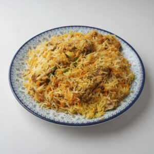 A delicious plate of chicken biryani made with spiced chicken, basmati rice, and fresh herbs, served hot in a traditional style