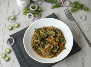 Delicious homemade fried okra bhindi cooked with onions, tomatoes, and spices